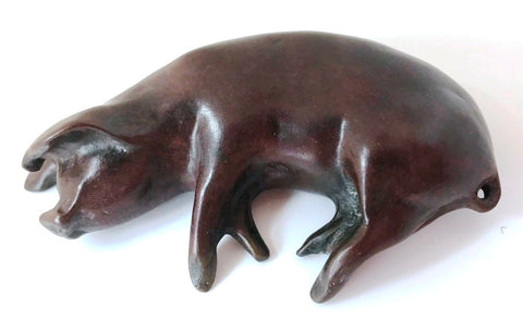 Slumbering pig by Sculptor Andrew Glasby